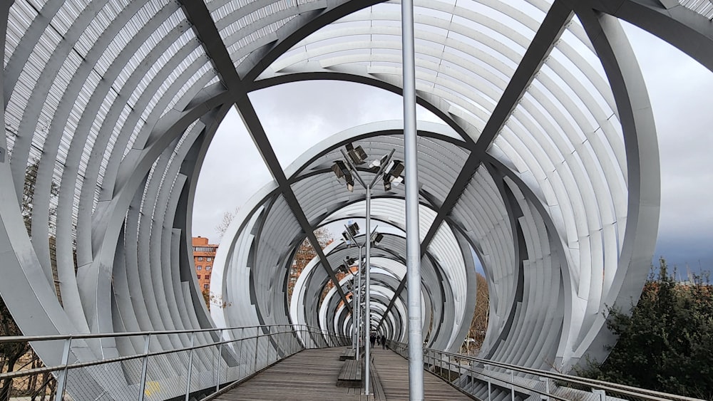 a walkway that has a bunch of arches on it