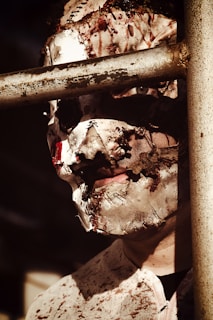a man with a face mask covered in dirt