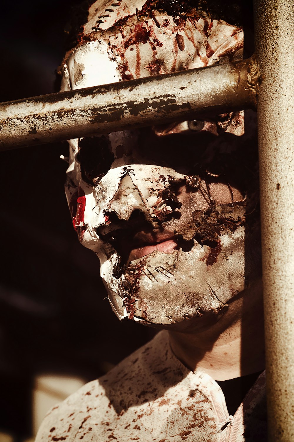 a man with a face mask covered in dirt