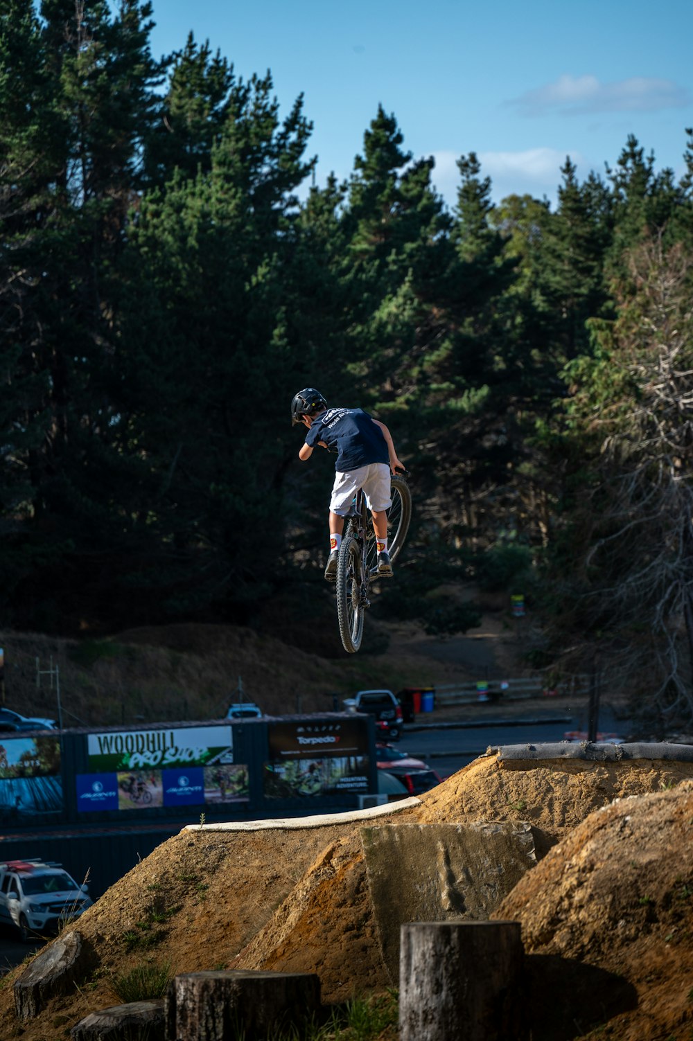 a man flying through the air while riding a bike