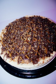 a chocolate covered pizza sitting on top of a pan