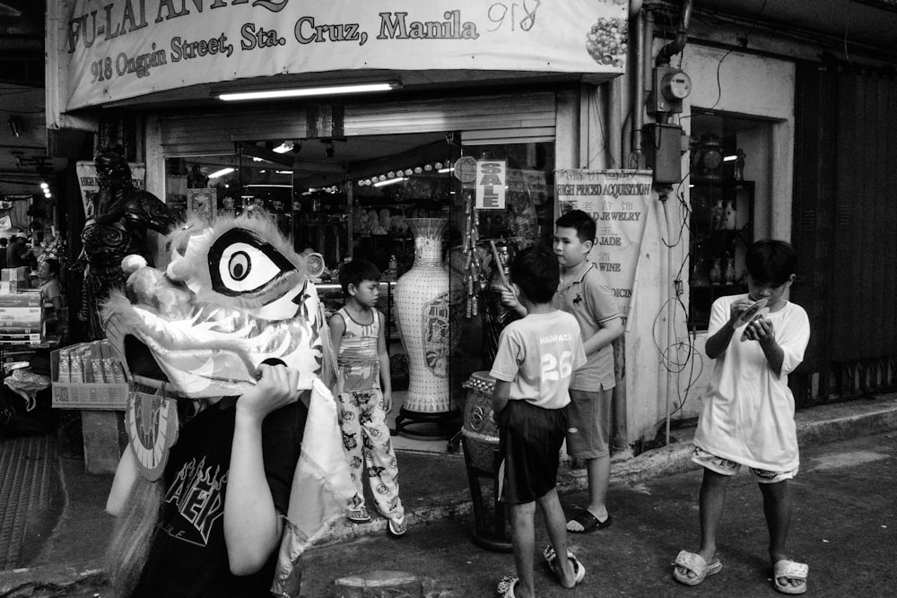 a black and white photo of a group of people in front of a store