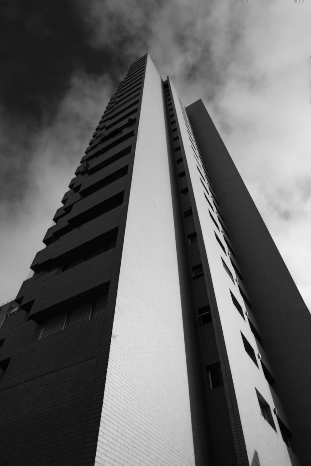 a tall building with a sky in the background