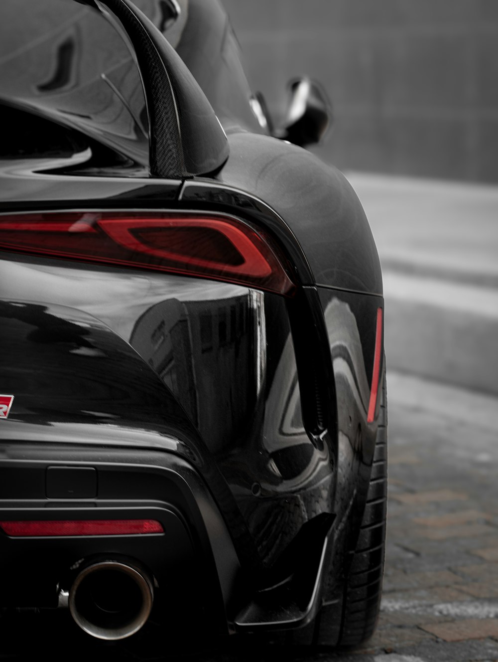 a black sports car parked on the side of the road