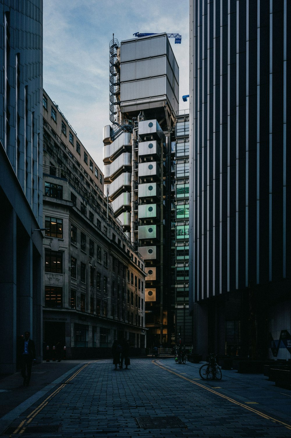 a city street with tall buildings in the background