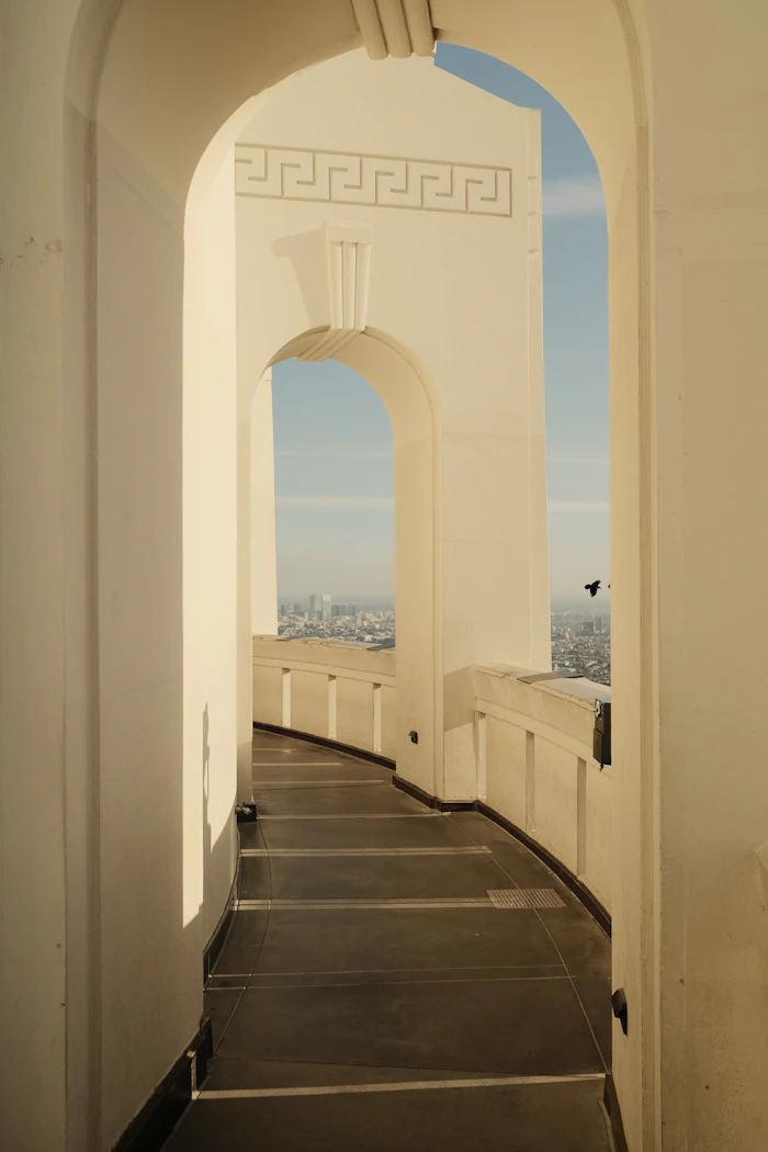 Griffith Observatory archways overlooking the Los Angeles skyline