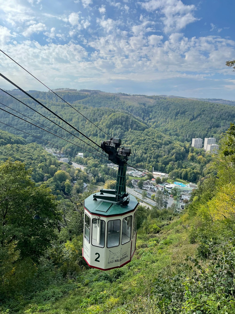 a cable car going up a hill in the mountains