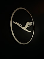 a logo of a fork on a black background