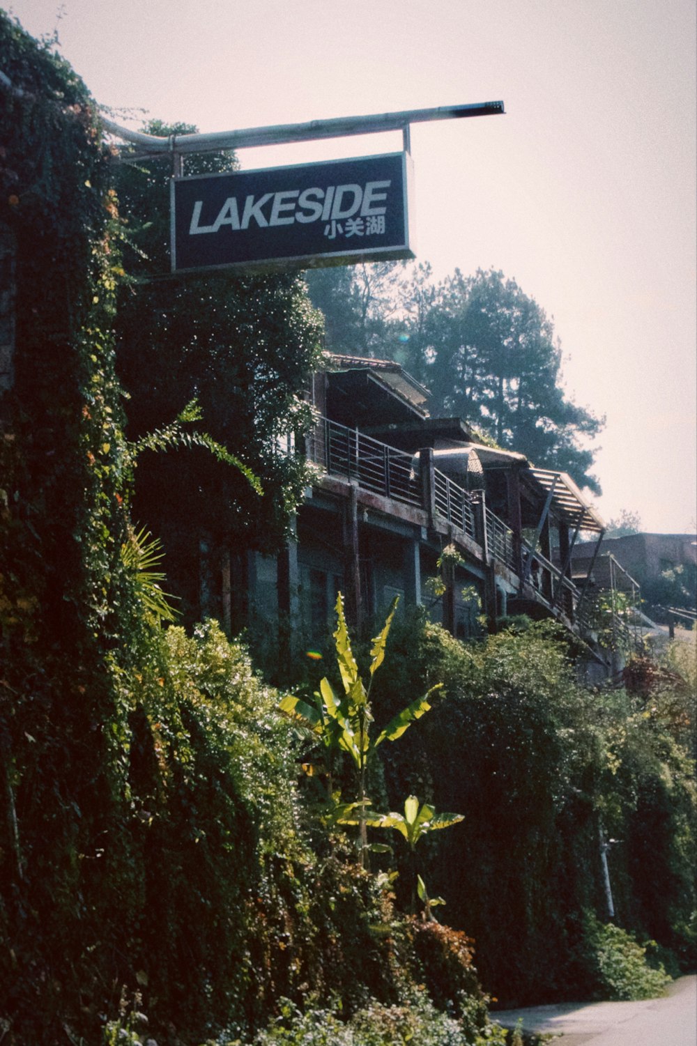 a sign hanging from the side of a building