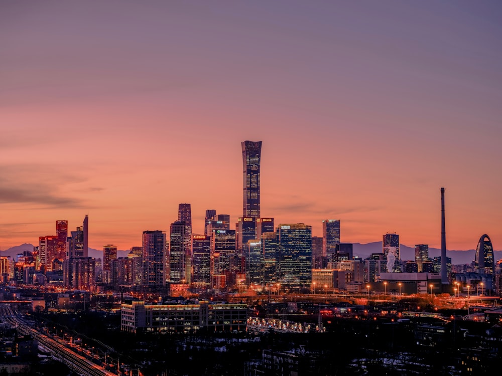 a view of a city skyline at sunset