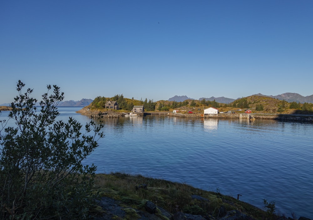 a body of water surrounded by mountains and trees