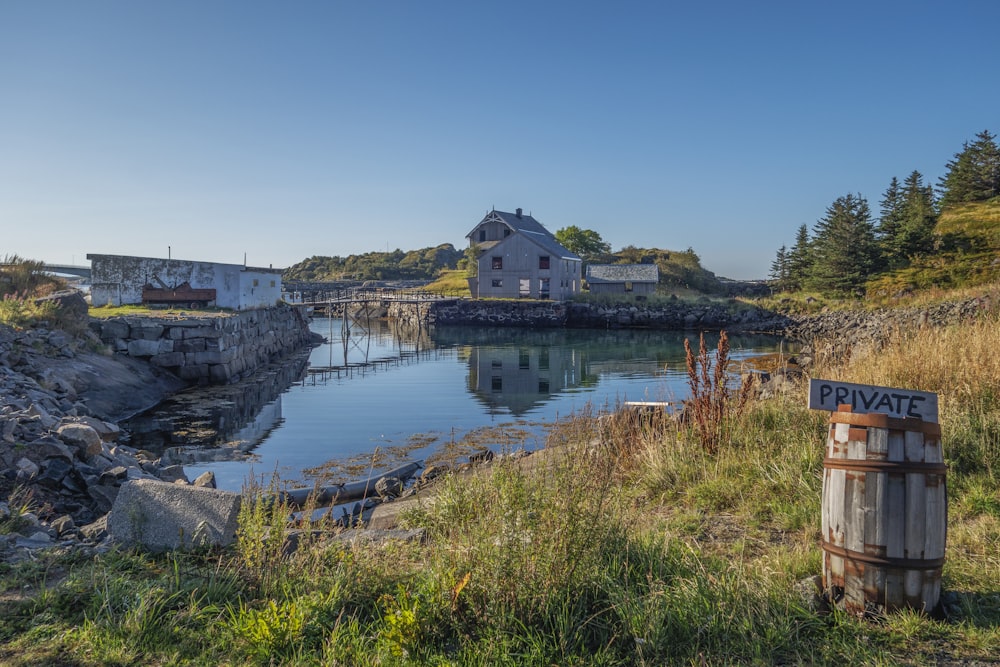 a body of water with a building in the background