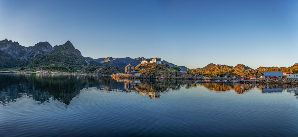 a lake with mountains in the background