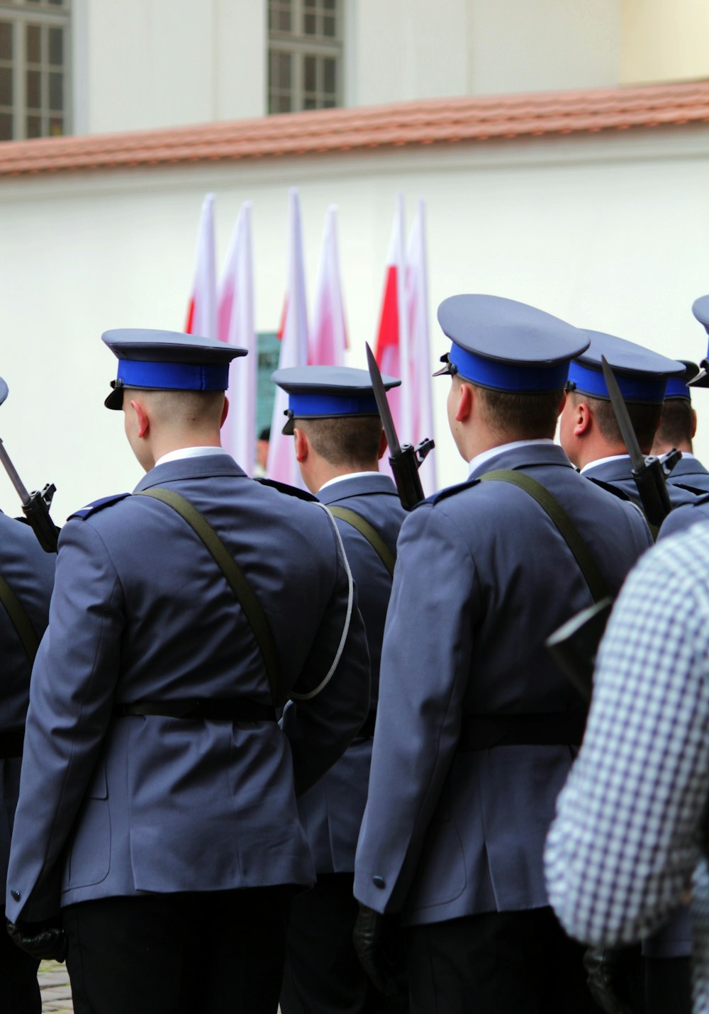 a group of uniformed men standing next to each other