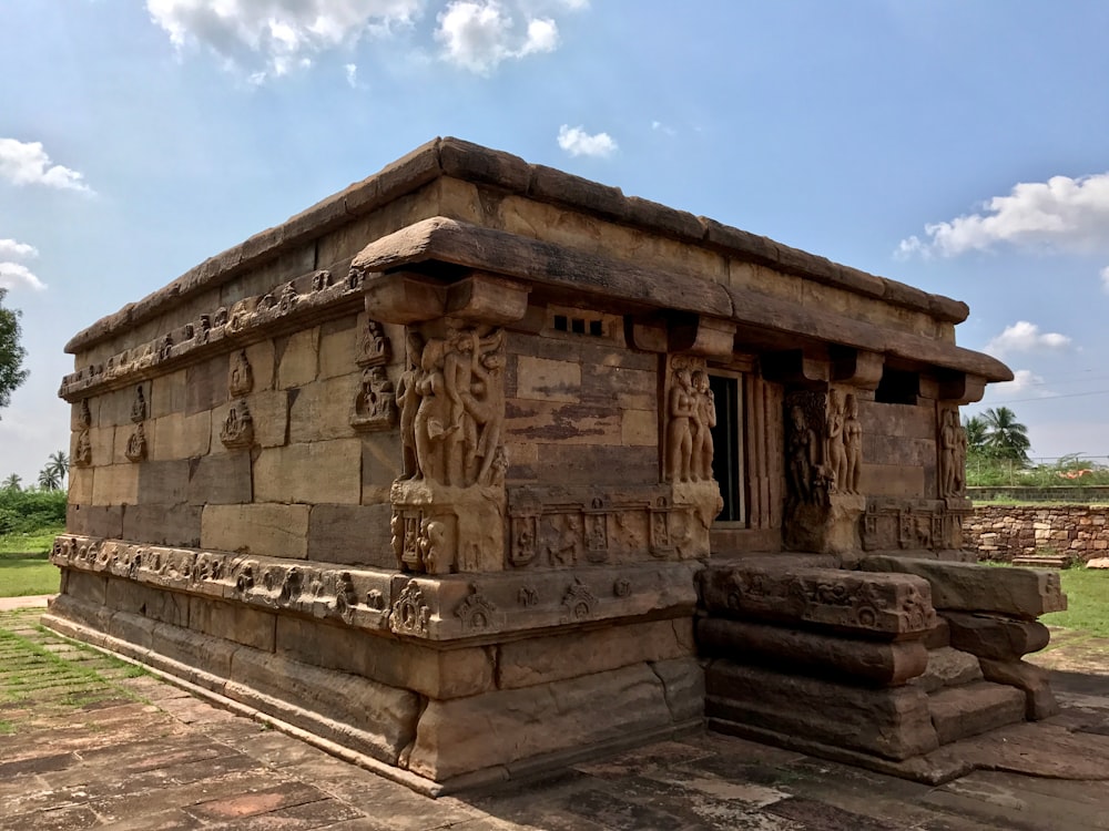 a stone structure with carvings on the outside of it