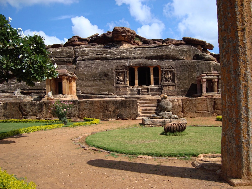 a stone building with a garden in front of it