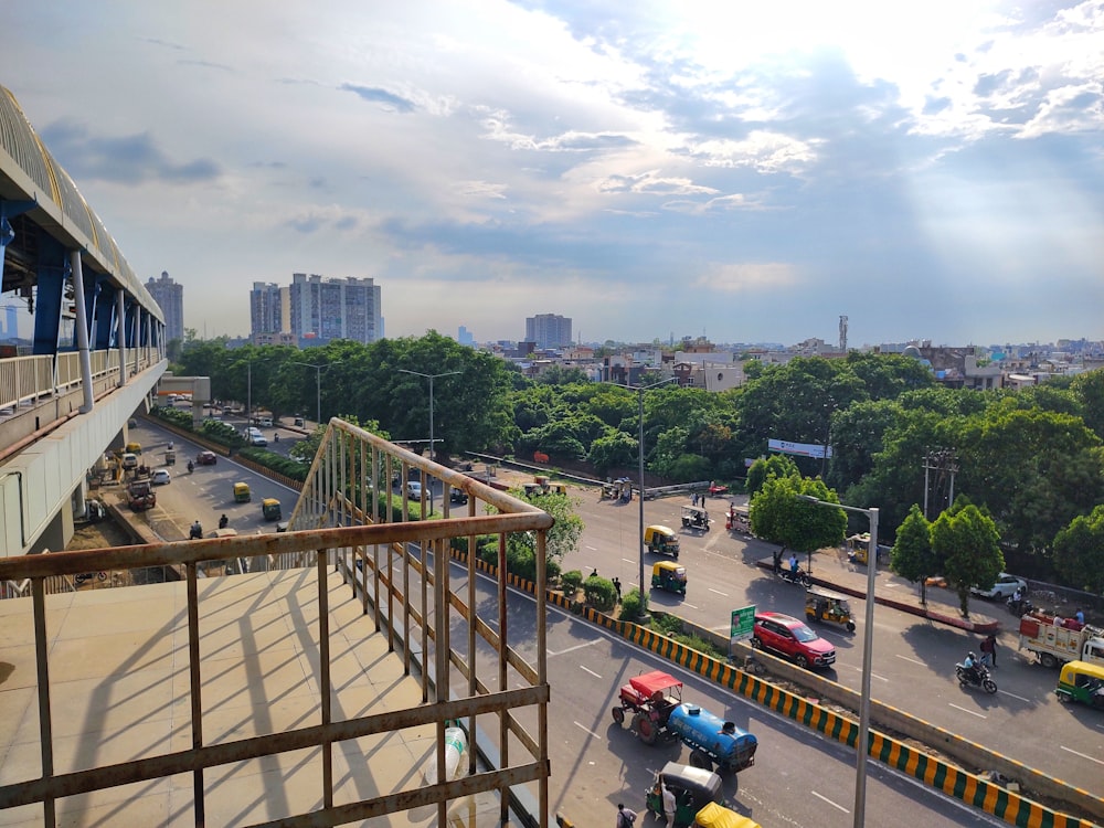 a view of a busy city street from a balcony