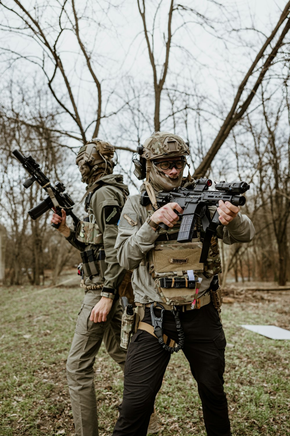 a couple of men with guns in their hands