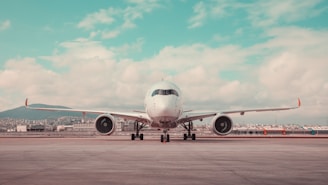 a large jetliner sitting on top of an airport tarmac