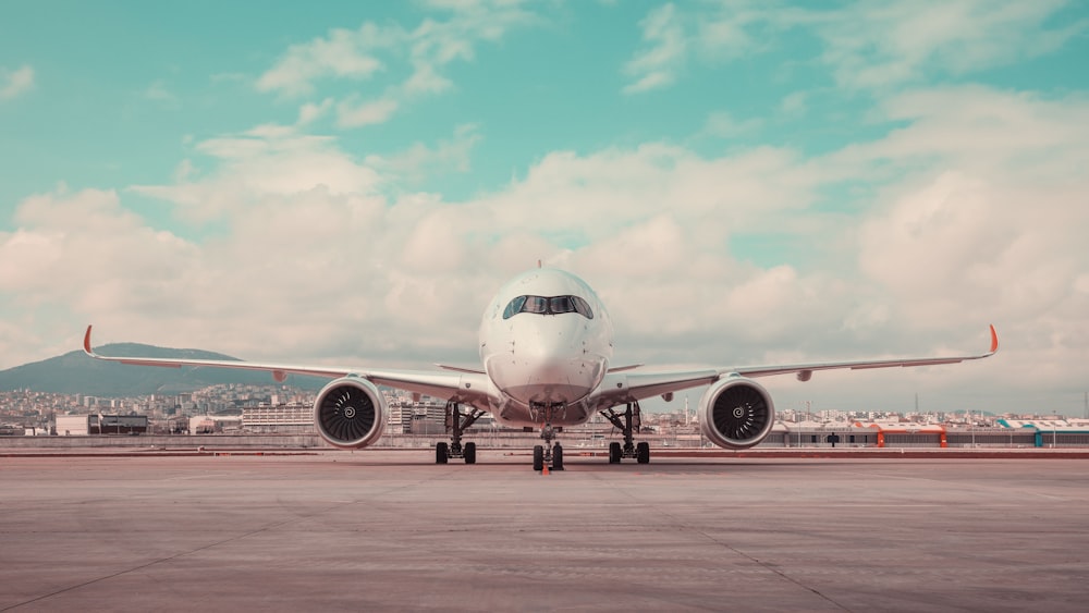 a large jetliner sitting on top of an airport tarmac