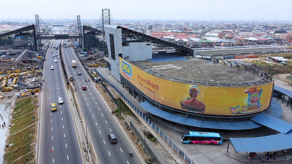 an aerial view of a stadium with a bus on the road