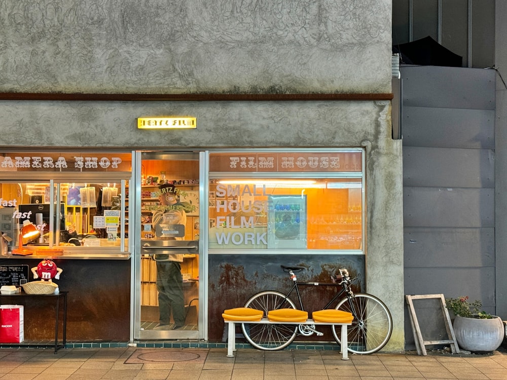 a bike parked outside of a store front