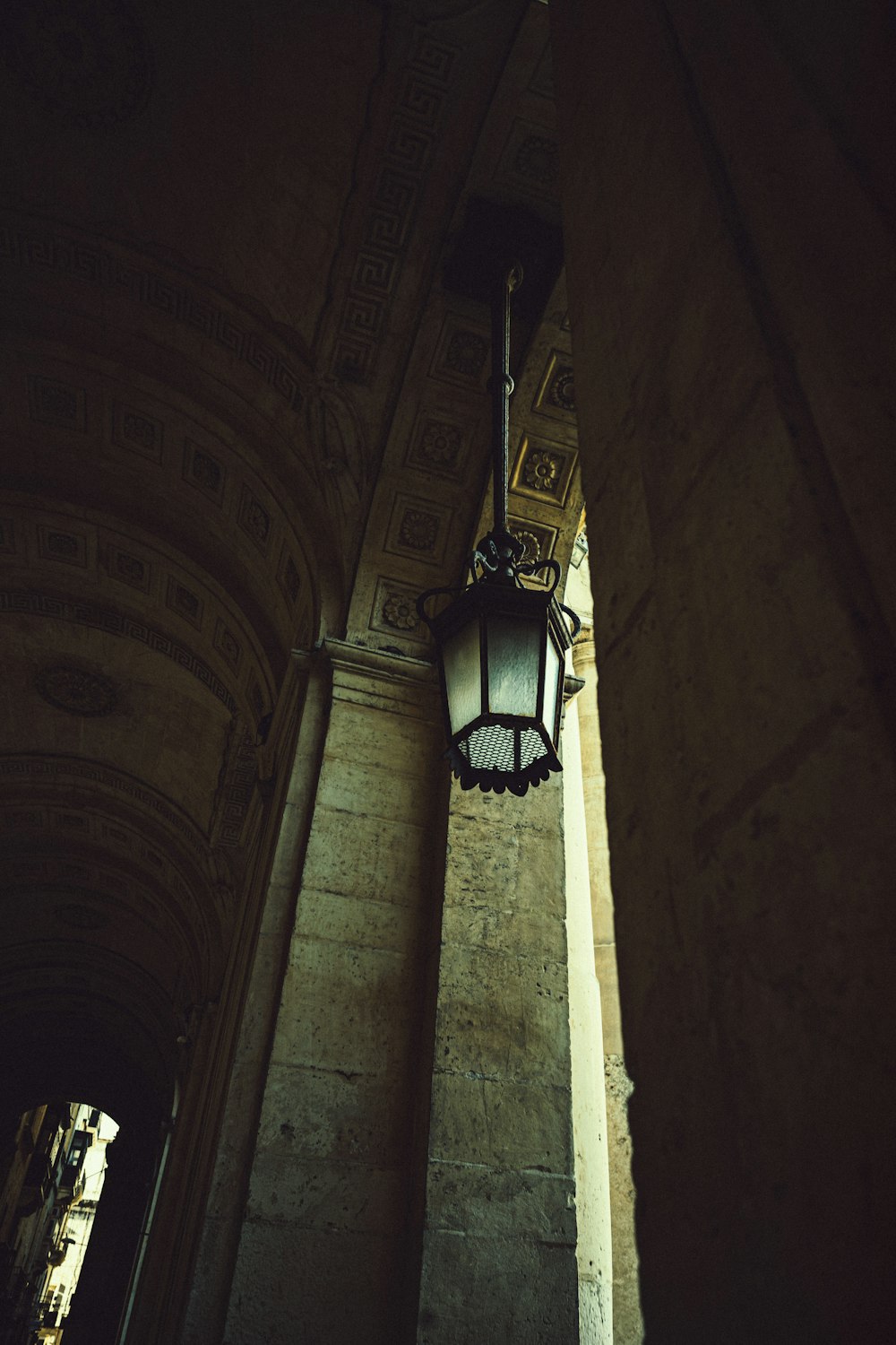 a street light hanging from the side of a building