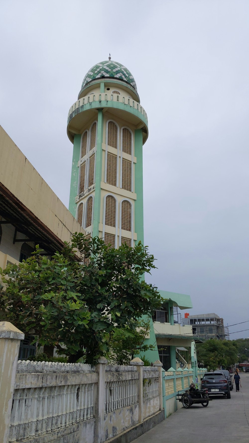 a tall tower with a clock on the top of it