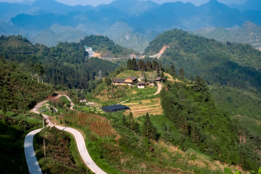 a scenic view of a mountain with a winding road