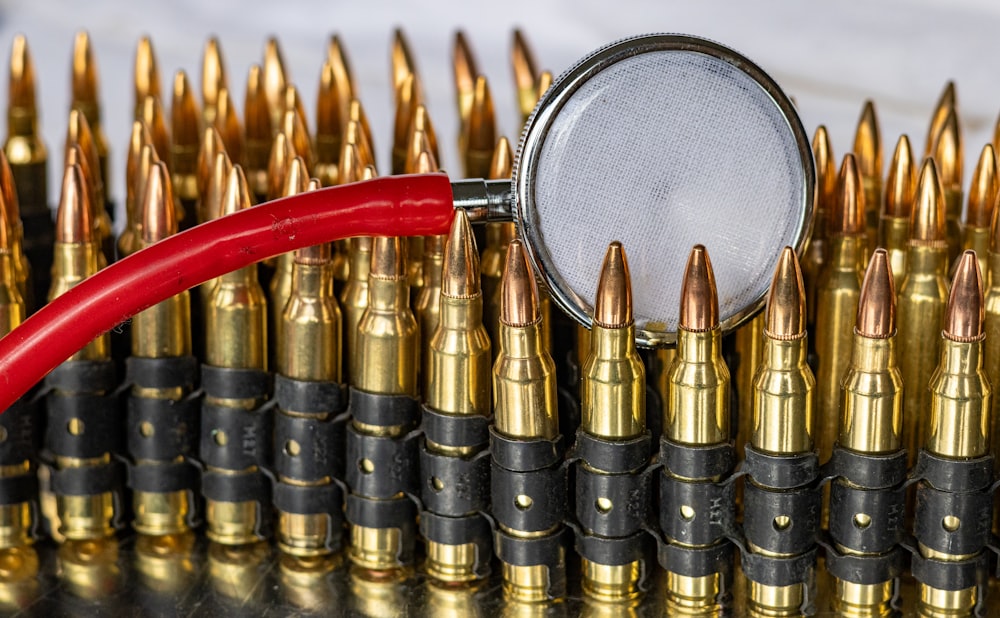 a magnifying glass over a bunch of bullet casings