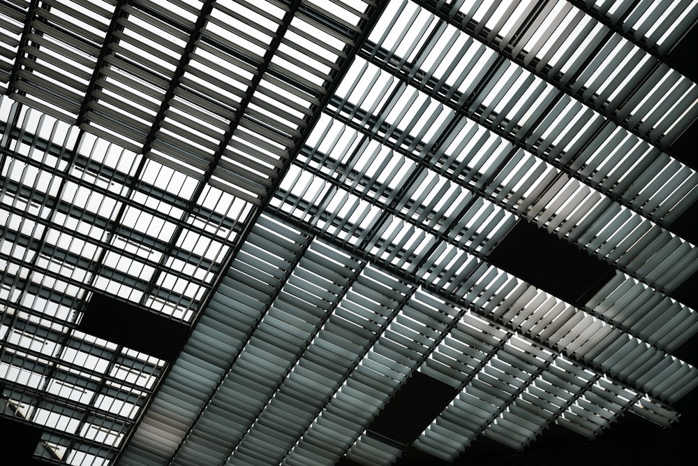 the ceiling of a train station with many windows