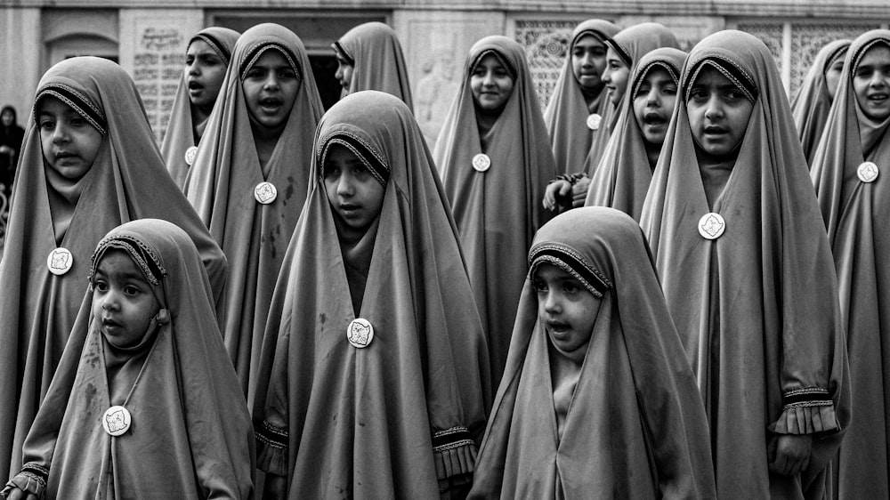 a group of people wearing headscarves and scarves