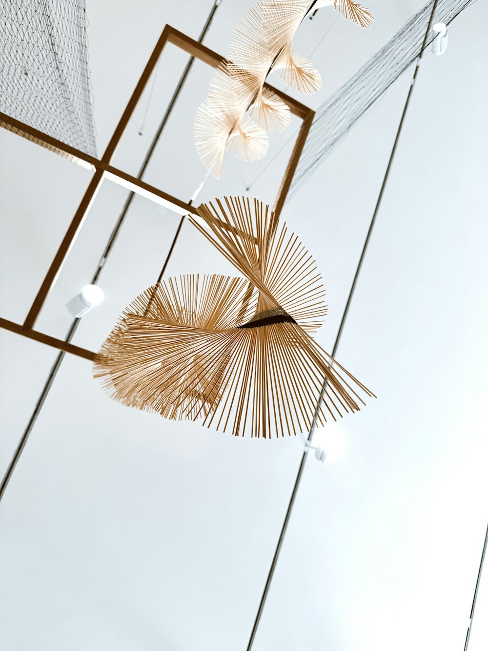 a group of decorative objects hanging from a ceiling