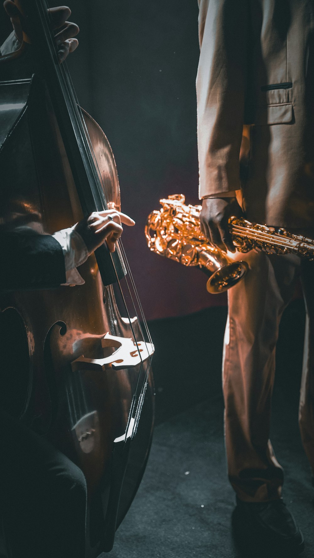 a man holding a saxophone in his right hand