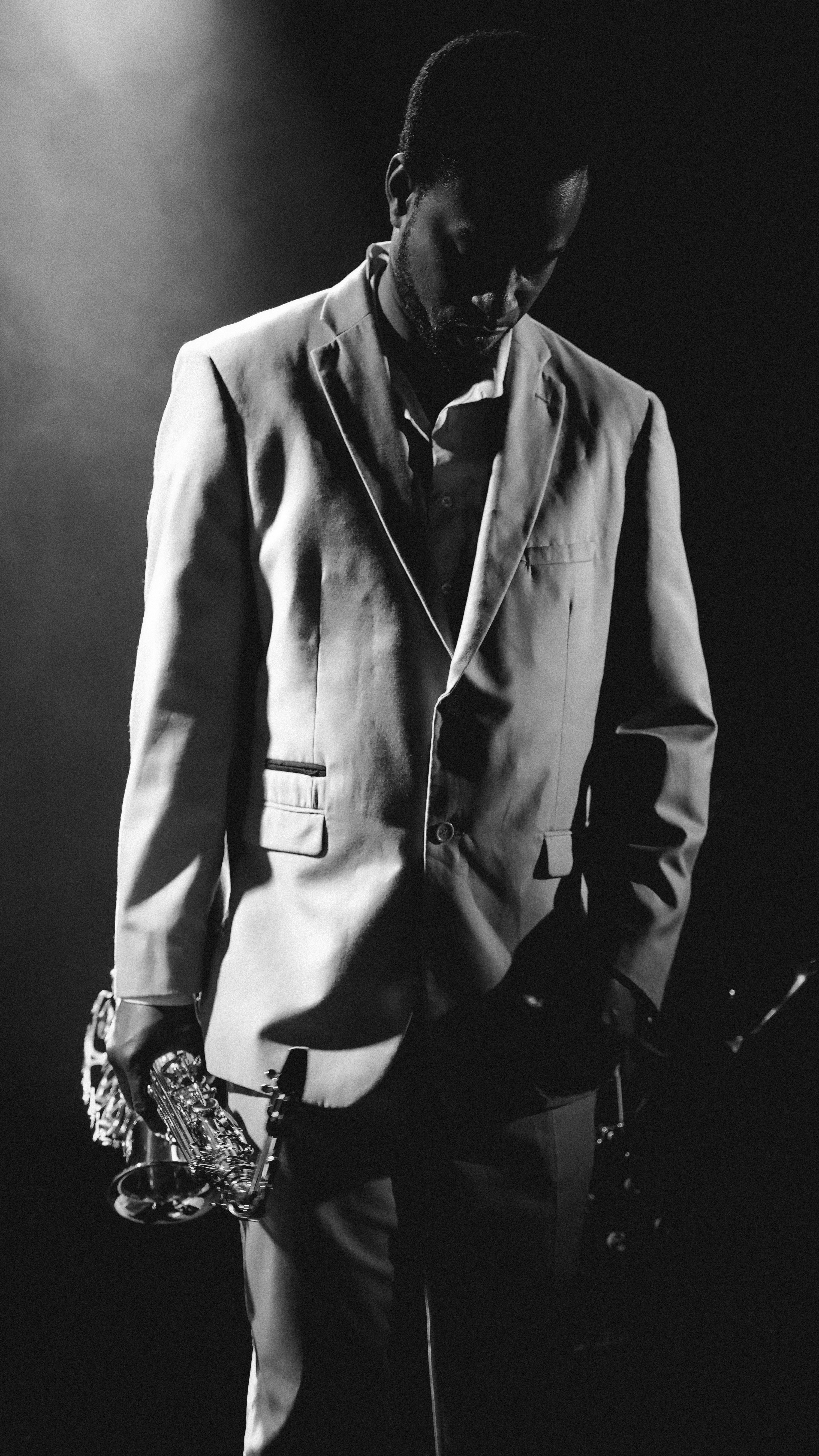 A black and white photo of a man in a suit photo – Free London Image on ...