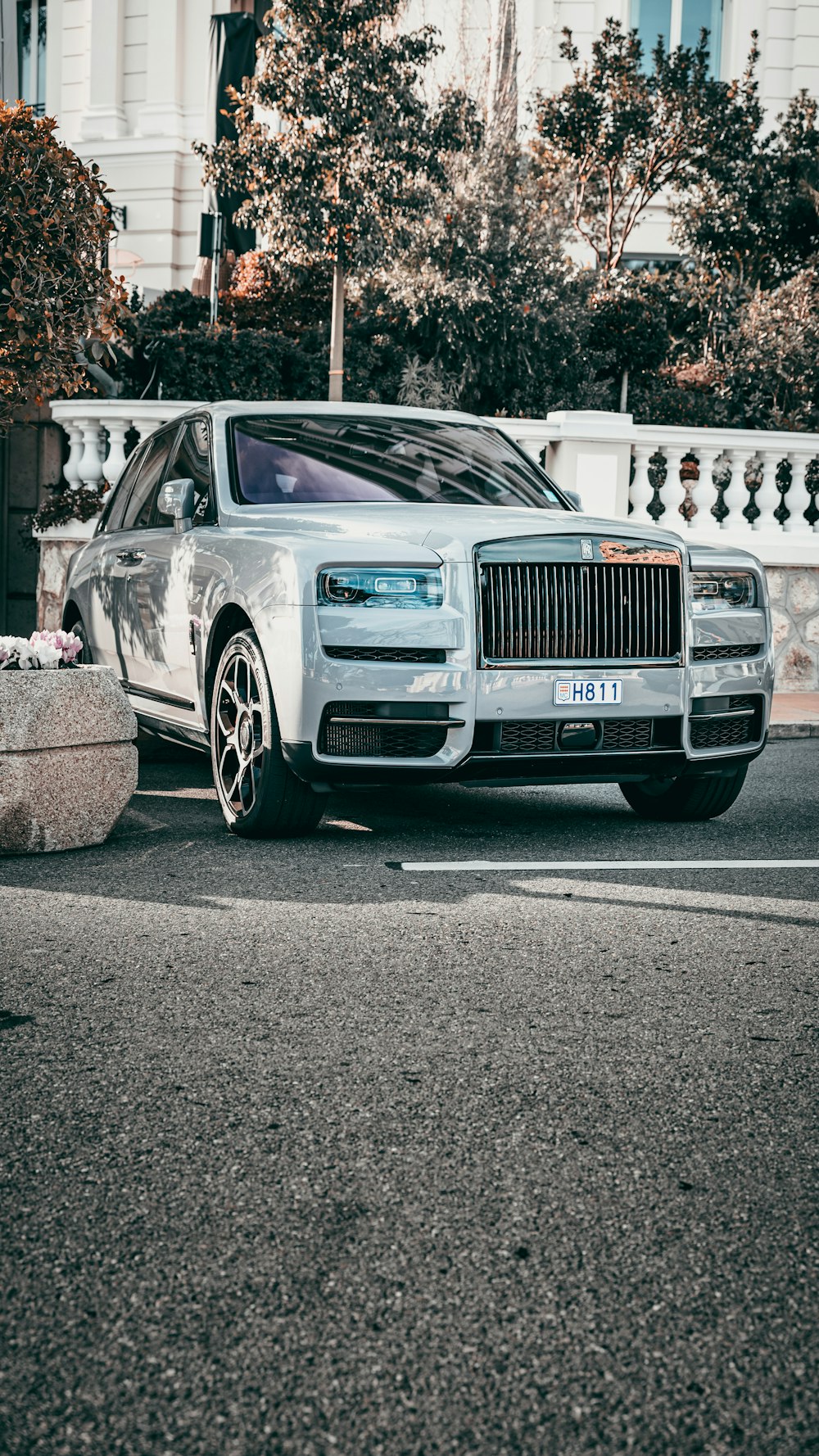 a rolls royce parked on the side of the road