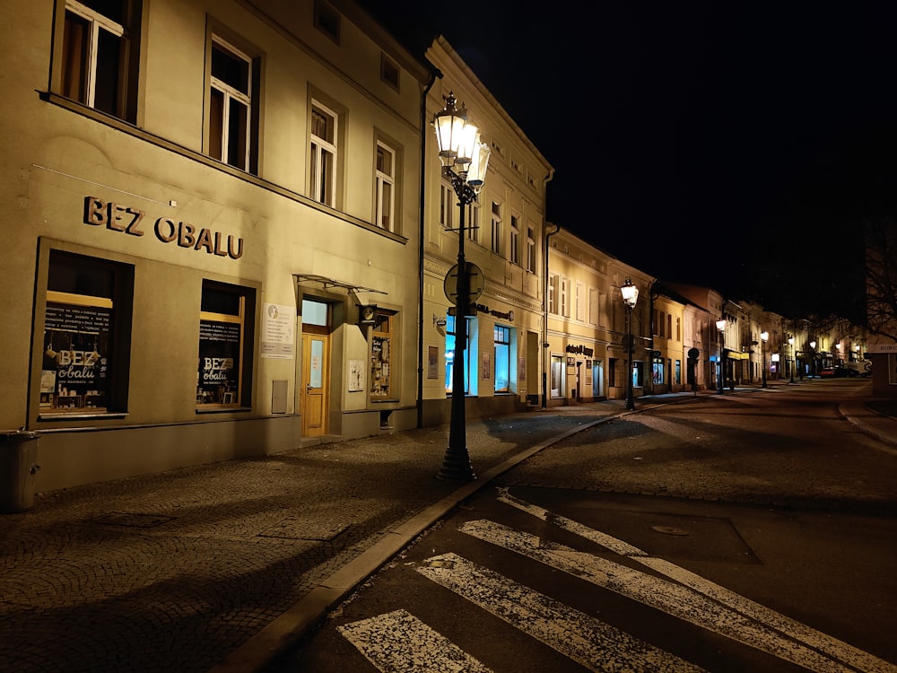 a city street at night with a street light