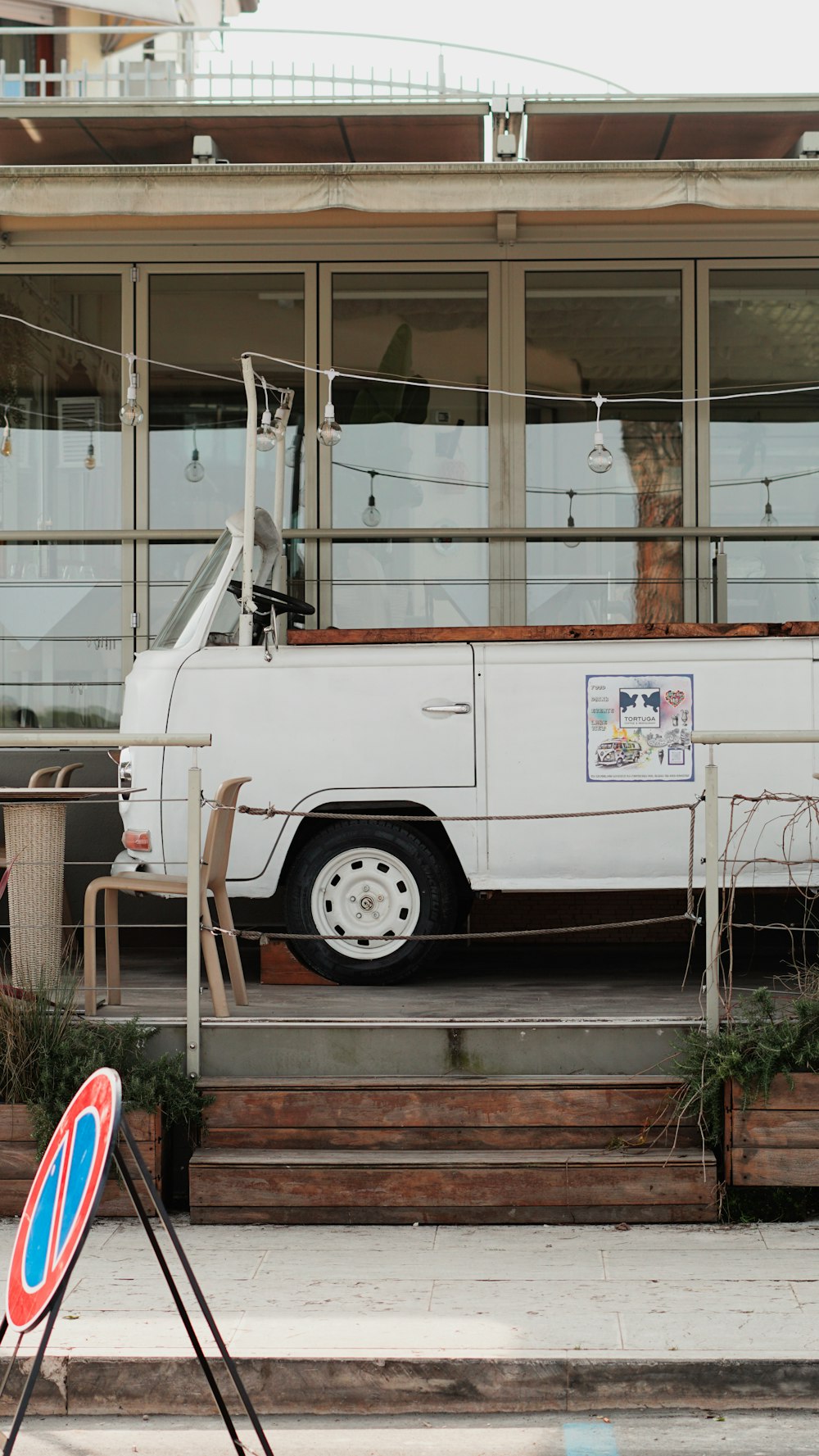 a white truck parked in front of a building