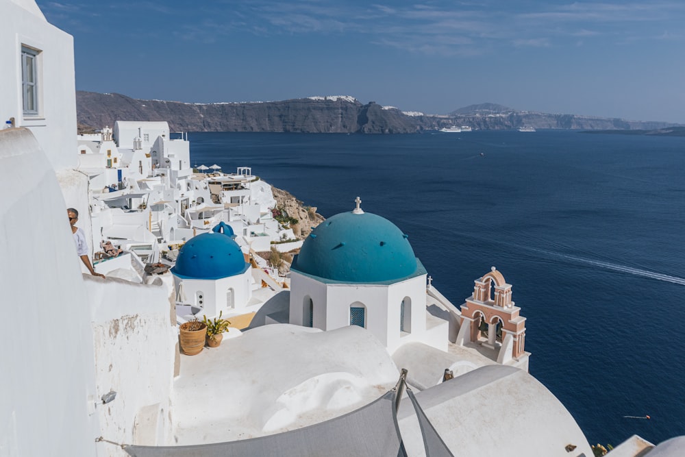 a white building with a blue dome on the top of it