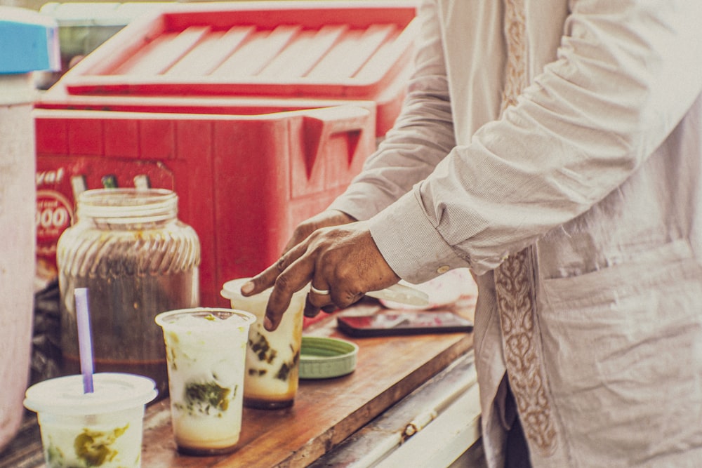 a man is preparing food on a table