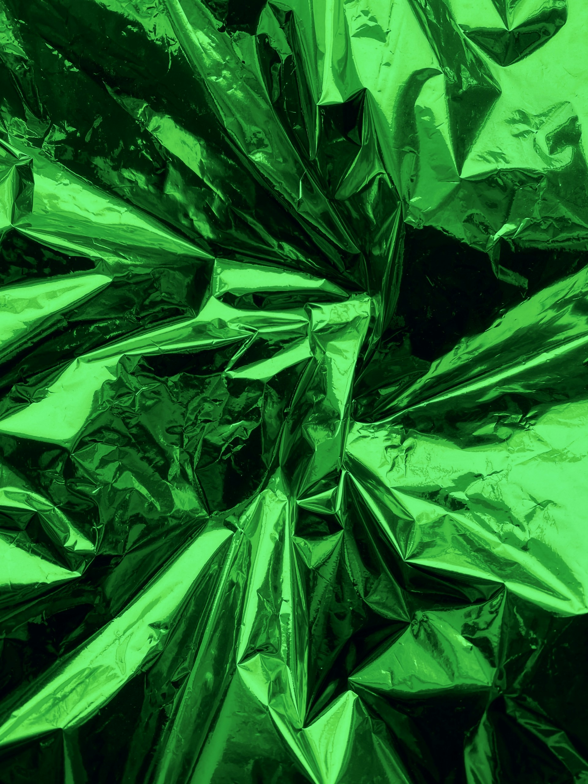 a close up of a shiny green material