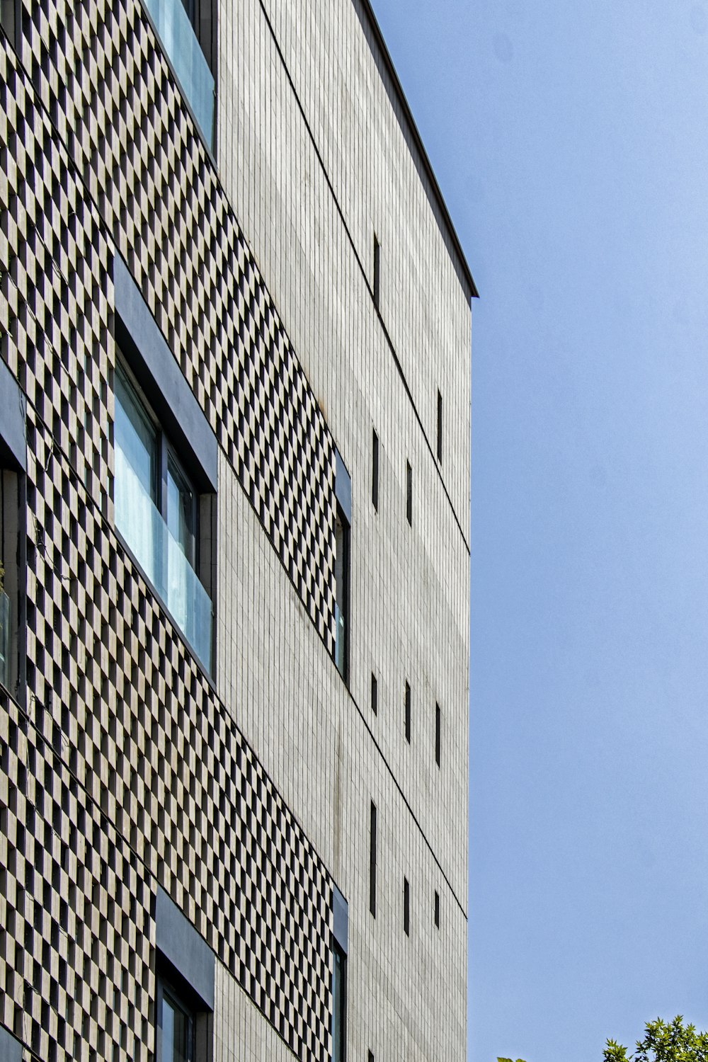 a tall building with a clock on the side of it