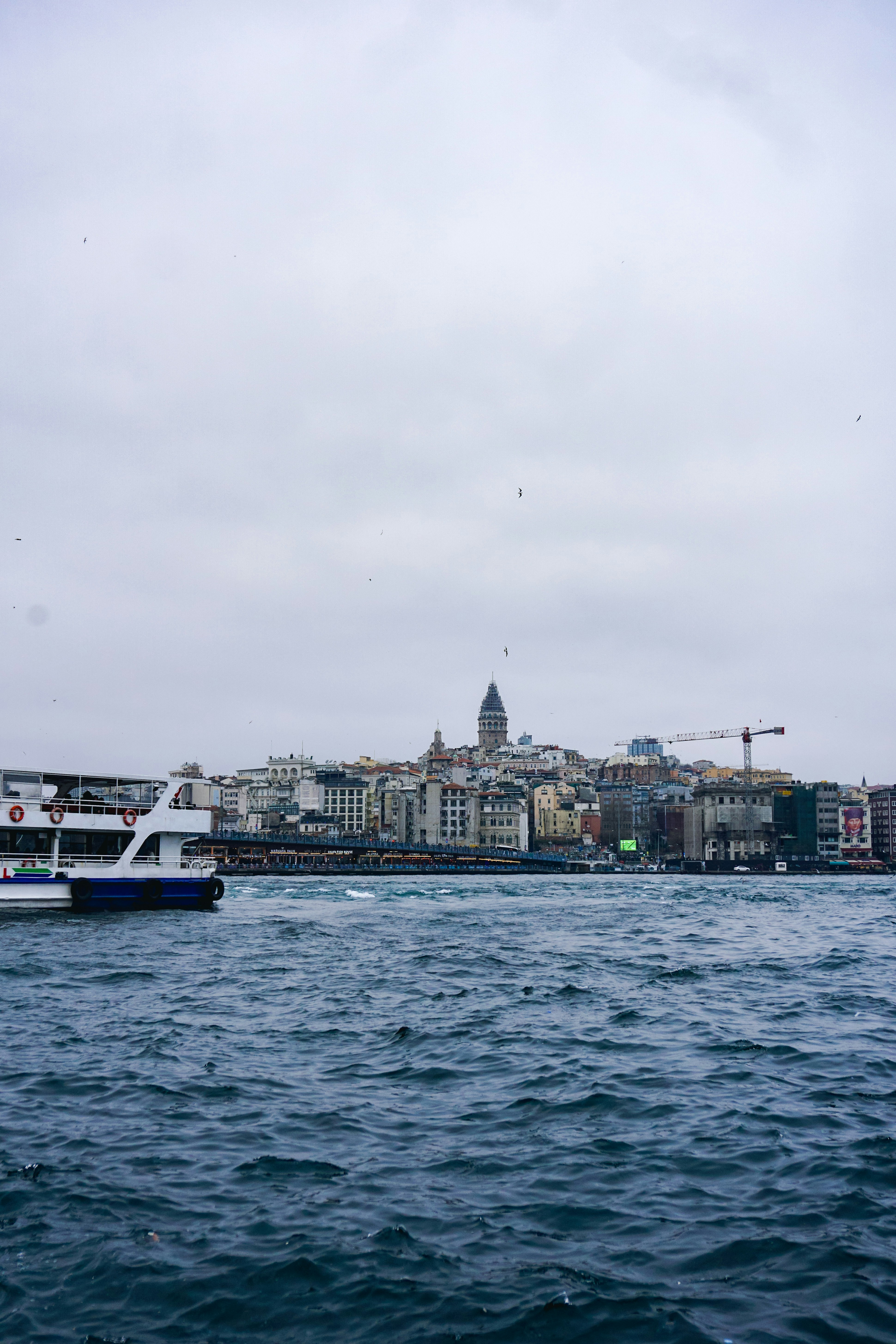 a large body of water with a city in the background