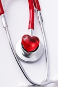 a stethoscope with a red heart on it