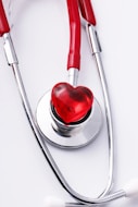 a stethoscope with a red heart on it