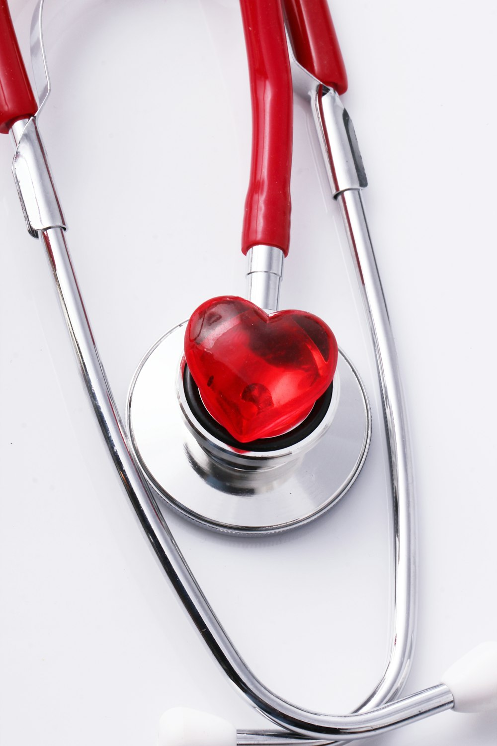 a stethoscope with a red heart on it