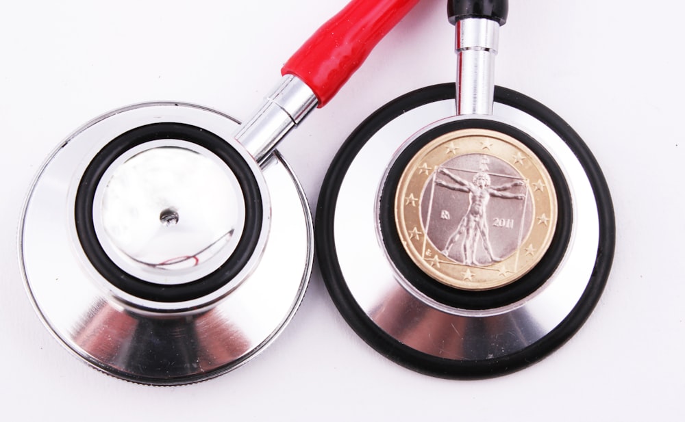 a stethoscope with a coin on top of it