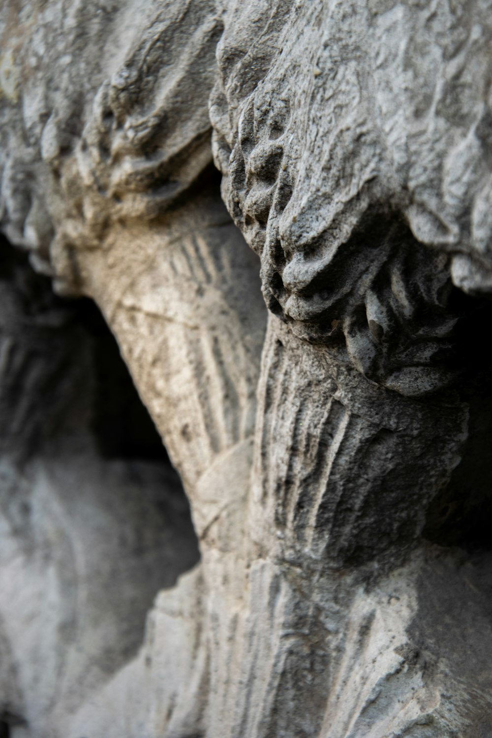 a close up of a rock formation with a bird perched on top of it