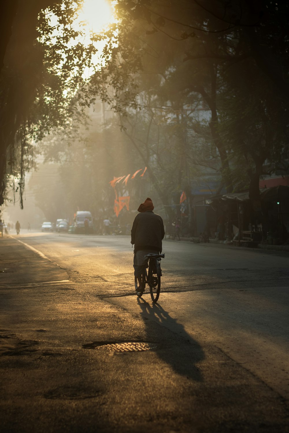 a person riding a bike down a street