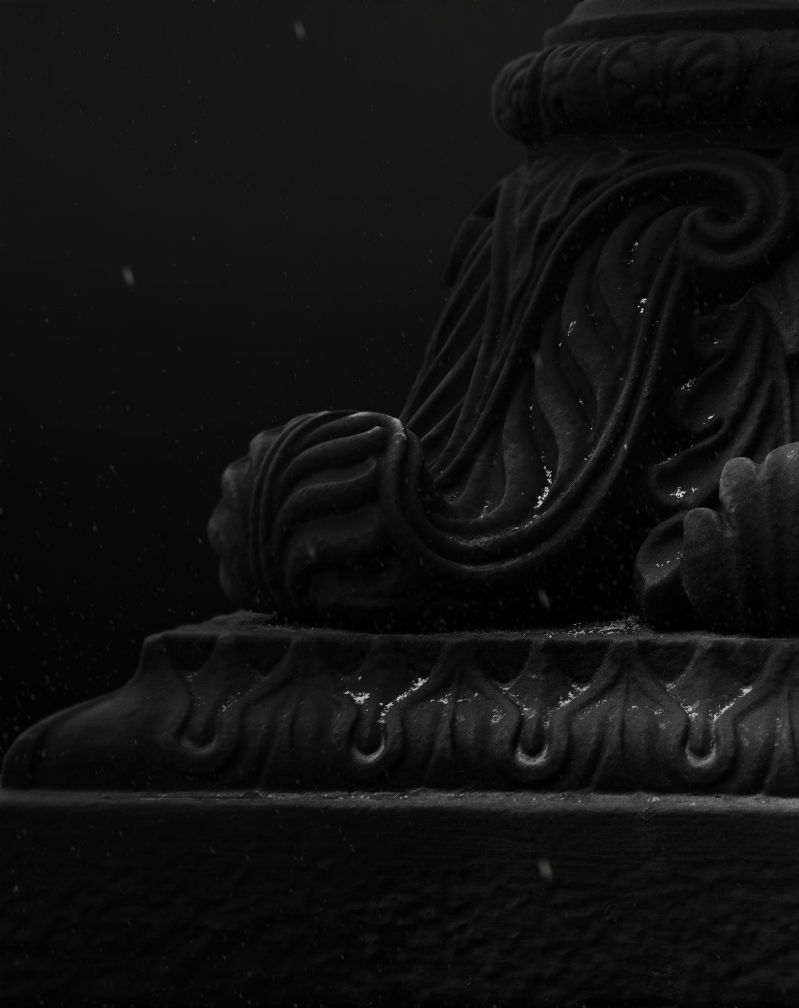 a black and white photo of a statue